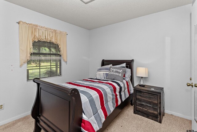 552 W State Highway 7, Crockett, TX 75835 - bedroom with carpet flooring and baseboards