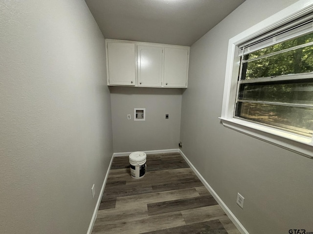 clothes washing area featuring cabinets, washer hookup, electric dryer hookup, and dark wood-type flooring