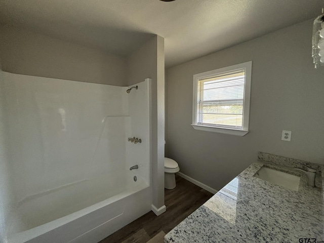 full bathroom with toilet, vanity, shower / bathing tub combination, and hardwood / wood-style flooring