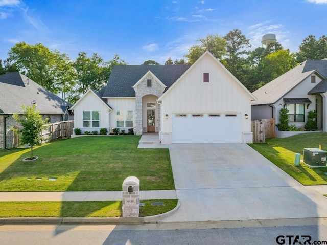 4188 Palo Pinto Creek Cir, Tyler, TX 75703 - view of front facade featuring board and batten siding, driveway, and an attached garage