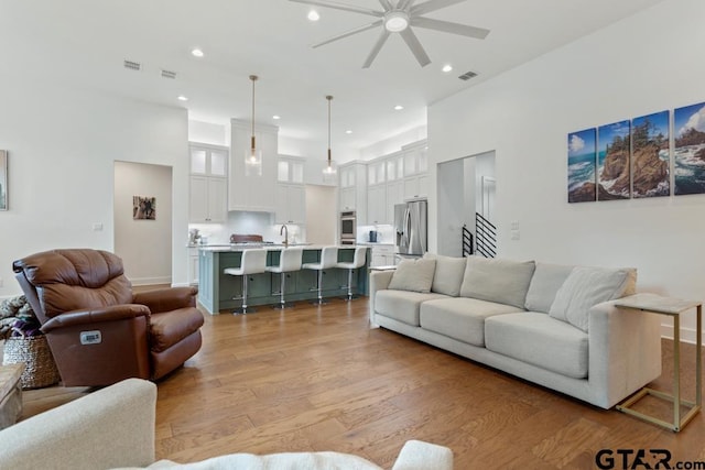 4188 Palo Pinto Creek Cir, Tyler, TX 75703 - living area featuring a ceiling fan, light wood finished floors, recessed lighting, and a towering ceiling