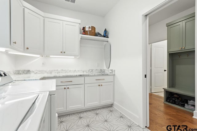 4188 Palo Pinto Creek Cir, Tyler, TX 75703 - washroom featuring cabinet space and washing machine and clothes dryer