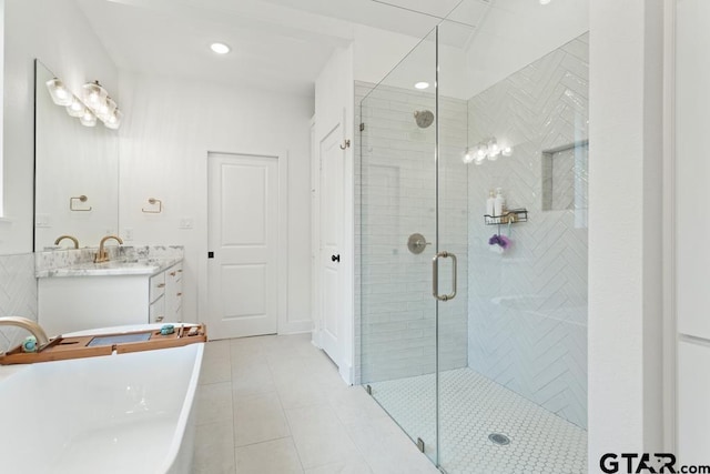4188 Palo Pinto Creek Cir, Tyler, TX 75703 - bathroom with vanity, a freestanding bath, a stall shower, tile patterned flooring, and recessed lighting