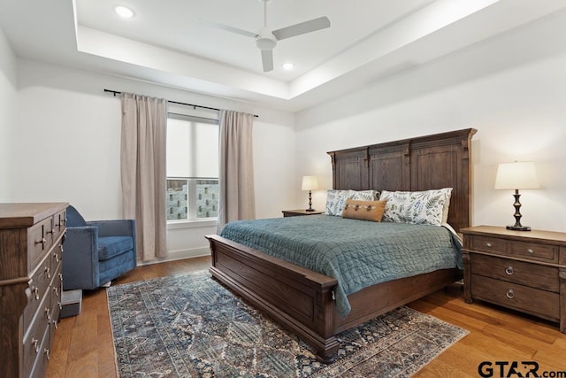 4188 Palo Pinto Creek Cir, Tyler, TX 75703 - bedroom featuring a raised ceiling, light wood-style flooring, recessed lighting, and ceiling fan