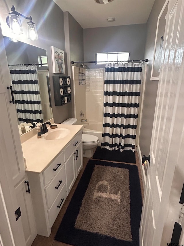 full bathroom with vanity, toilet, and shower / tub combo