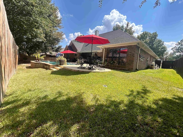 view of yard featuring a patio and a pool with hot tub