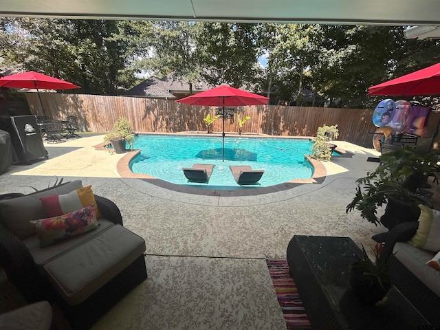 view of pool featuring a patio