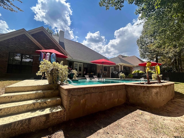 view of swimming pool with a patio area