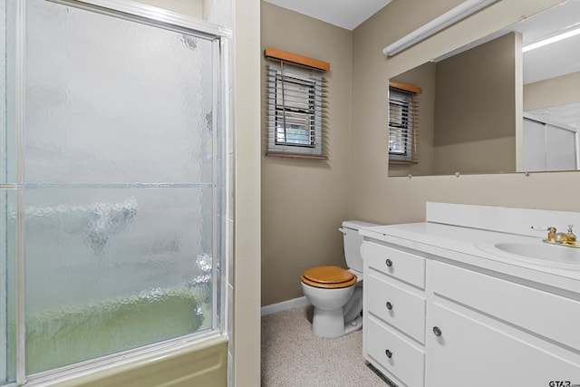 full bathroom with baseboards, toilet, vanity, an enclosed shower, and speckled floor