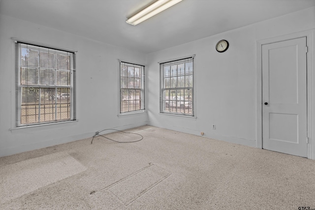 spare room featuring carpet flooring