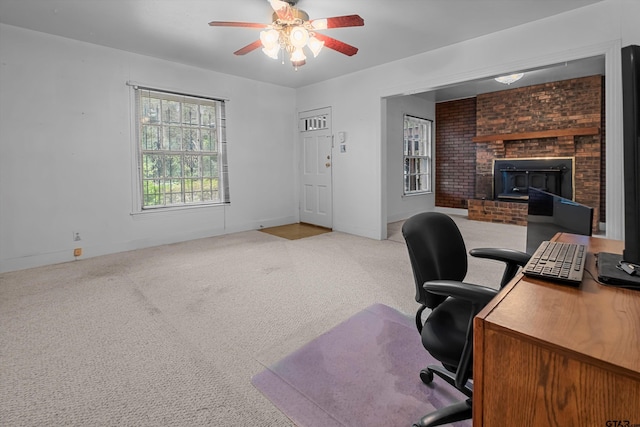 home office with carpet floors and a ceiling fan