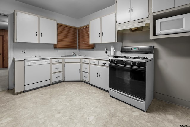 kitchen featuring range with gas stovetop, light countertops, white cabinetry, dishwasher, and under cabinet range hood