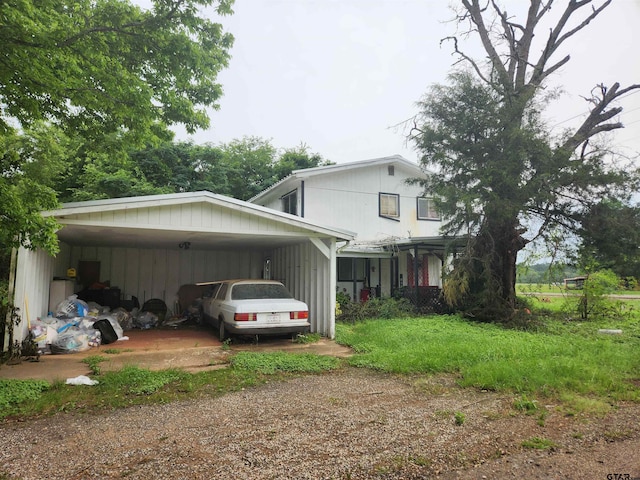 view of side of home featuring a carport