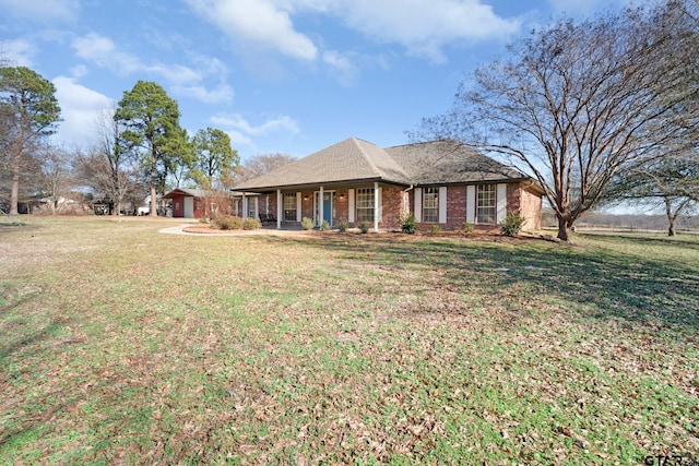 ranch-style house featuring a front lawn