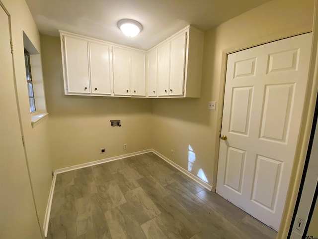 clothes washing area with washer hookup, electric dryer hookup, cabinets, and light hardwood / wood-style flooring