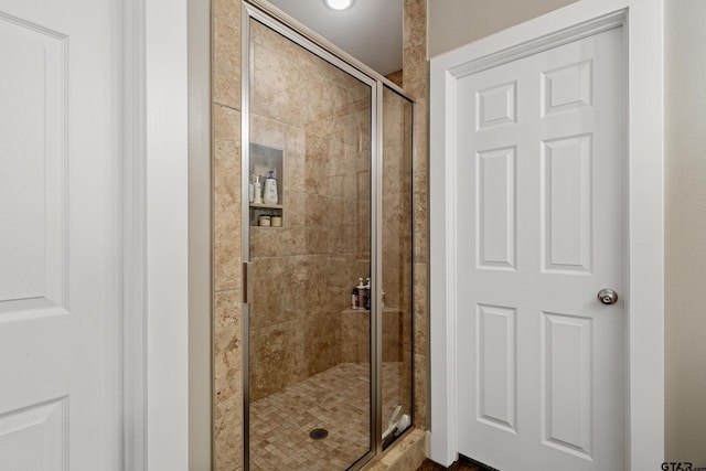 full bathroom featuring a shower stall