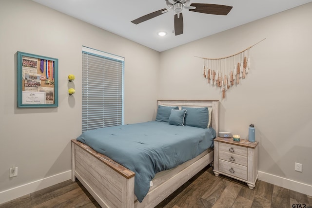 bedroom featuring dark wood-type flooring, baseboards, and a ceiling fan