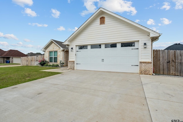 ranch-style home featuring driveway, fence, a front lawn, and brick siding