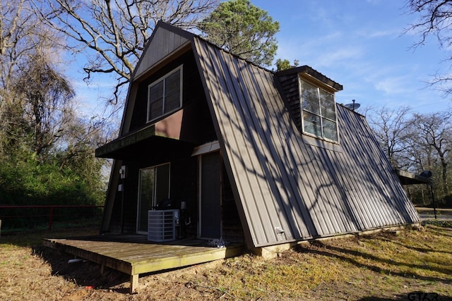 6385 Wagon Tree Trl, Athens, TX 75751 - rear view of property featuring central AC and a gambrel roof