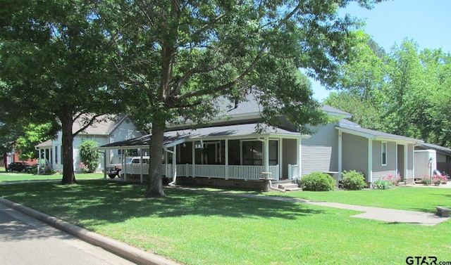 view of front of house with covered porch and a front yard