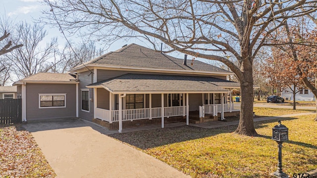 view of front of home with a front yard and a porch