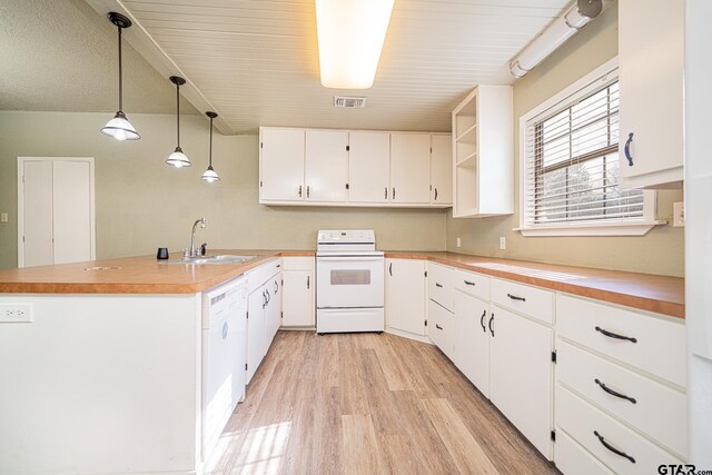 kitchen featuring decorative light fixtures, sink, white appliances, light wood-type flooring, and white cabinets