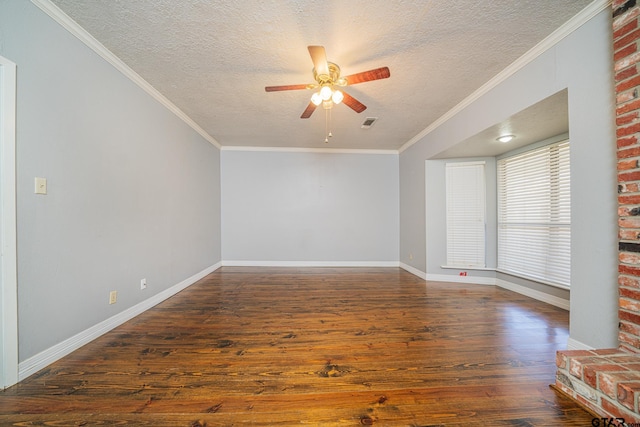 unfurnished living room featuring ceiling fan, dark hardwood / wood-style floors, crown molding, and a textured ceiling