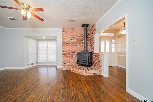 unfurnished living room with ceiling fan, dark wood-type flooring, a textured ceiling, and ornamental molding