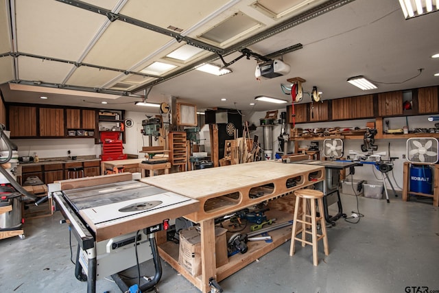 garage featuring a workshop area and a garage door opener