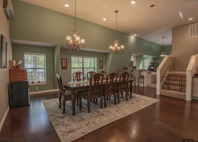 dining space featuring an AC wall unit, plenty of natural light, high vaulted ceiling, and dark wood-type flooring