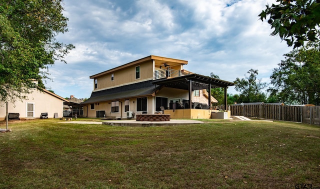 back of house with a yard, a patio, and a pergola