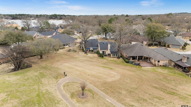 birds eye view of property with a residential view