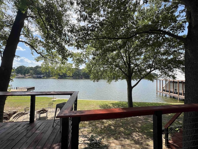 306 Lake Dr, Mount Vernon, TX 75457 - wooden terrace featuring a water view and a yard