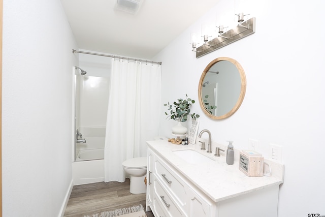 306 Lake Dr, Mount Vernon, TX 75457 - full bathroom with wood finished floors, toilet, vanity, and shower / bath combo with shower curtain