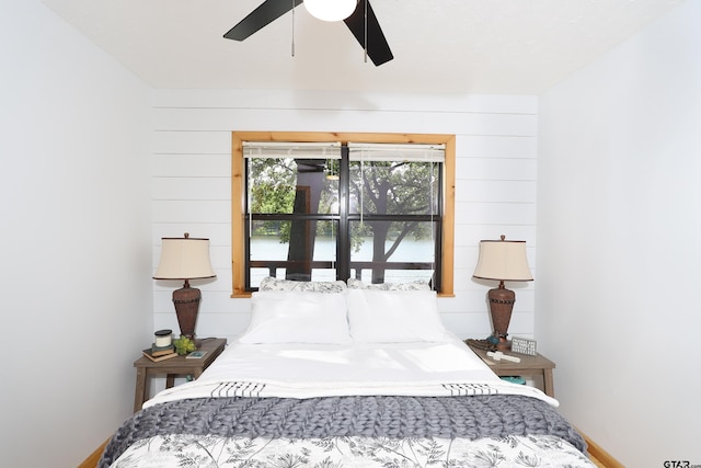 306 Lake Dr, Mount Vernon, TX 75457 - bedroom featuring a water view, baseboards, and ceiling fan