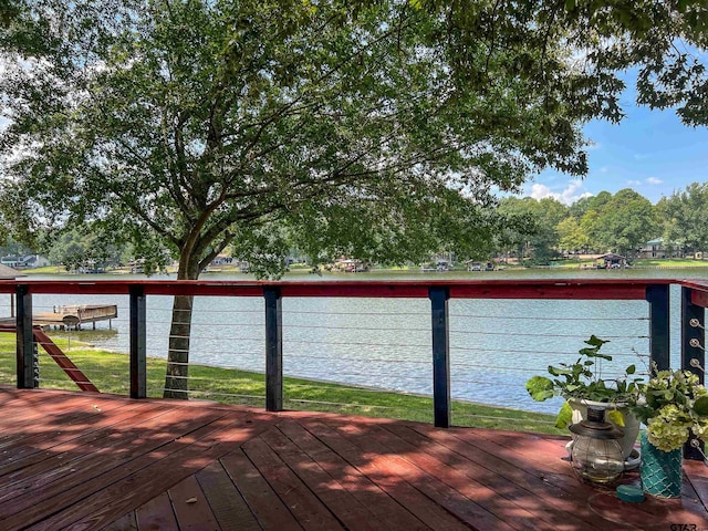 306 Lake Dr, Mount Vernon, TX 75457 - wooden deck with a water view