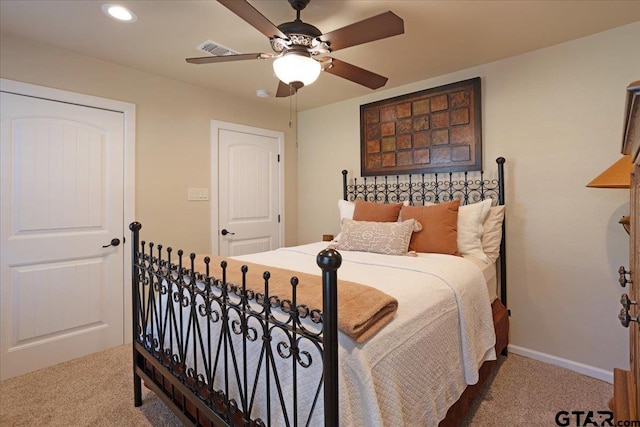 carpeted bedroom with ceiling fan