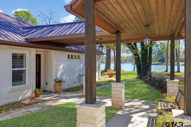 view of patio / terrace featuring a water view