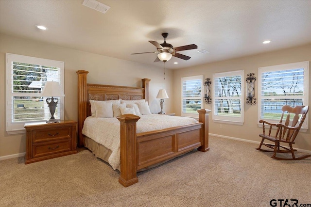 bedroom featuring ceiling fan and light colored carpet