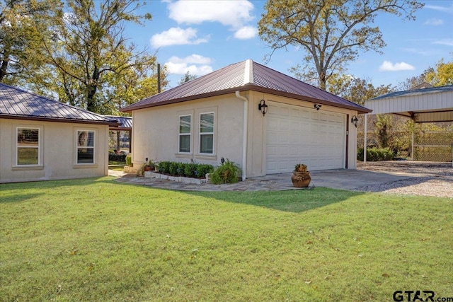 view of property exterior with a lawn, an outdoor structure, and a garage