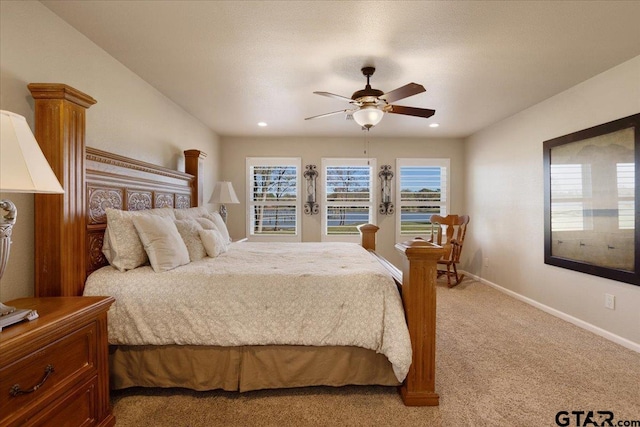 bedroom featuring ceiling fan and light colored carpet