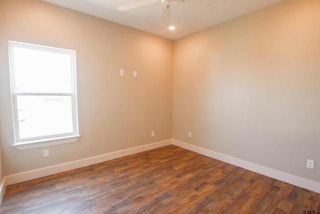 empty room with recessed lighting, dark wood-style floors, baseboards, and a ceiling fan