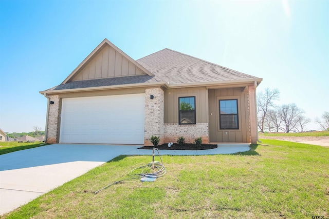 view of front of property with board and batten siding, a front lawn, an attached garage, a shingled roof, and concrete driveway