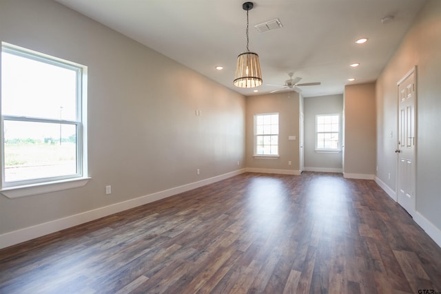 unfurnished room with recessed lighting, dark wood-style flooring, baseboards, and ceiling fan