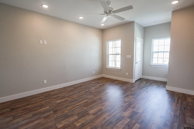 empty room featuring dark wood-style flooring, baseboards, a ceiling fan, and recessed lighting