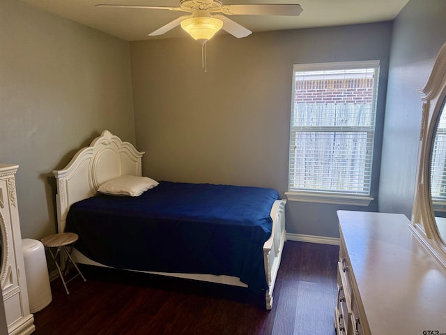 bedroom with dark wood-type flooring and ceiling fan