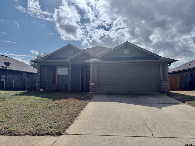 single story home featuring a garage and a front yard