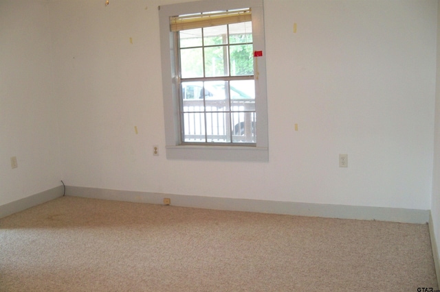 411 N College St, Lindale, TX 75771 - unfurnished room with carpet flooring and baseboards