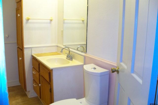 411 N College St, Lindale, TX 75771 - half bath with vanity, toilet, and wood finished floors