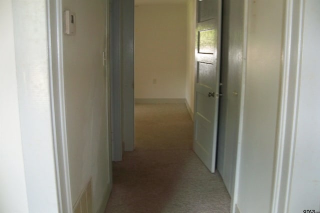 411 N College St, Lindale, TX 75771 - hallway featuring light carpet